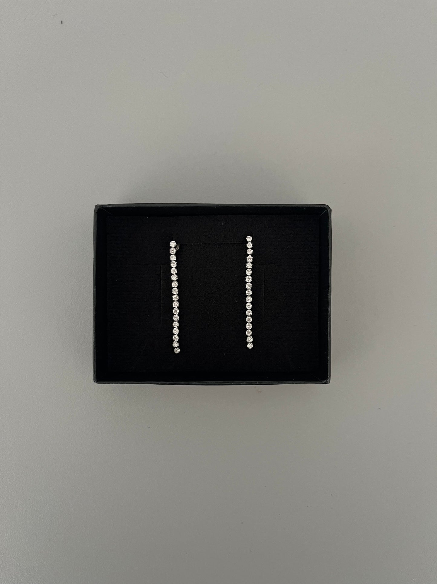 Aretes largos fila