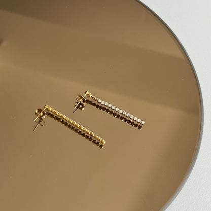 Aretes largos fila